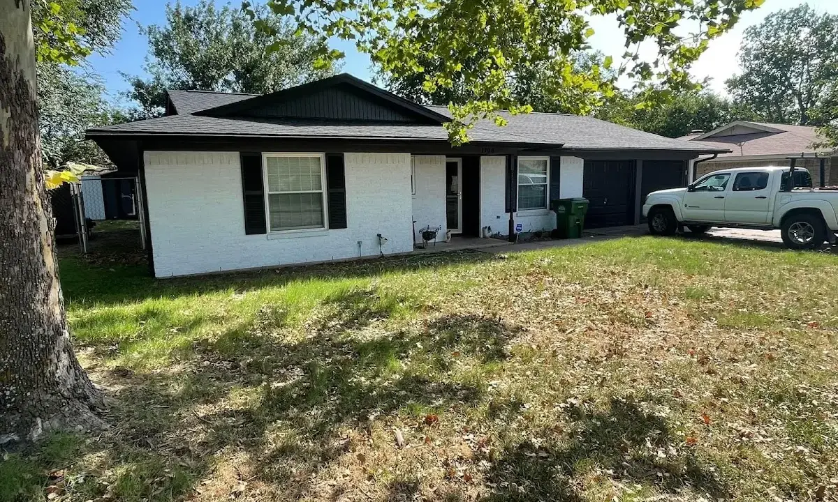 Professional roofing crew working on a residential roof in North Salt Lake